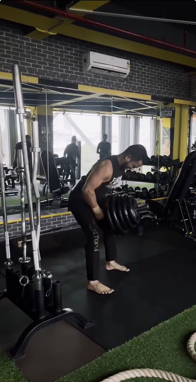 Dumbbell row with the plate stack
