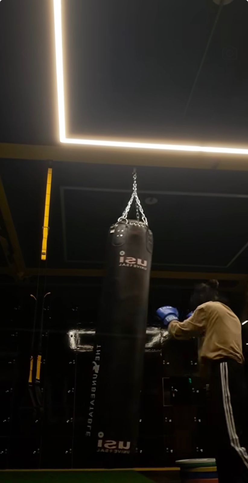 Heavy bag striking session in the boxing corner