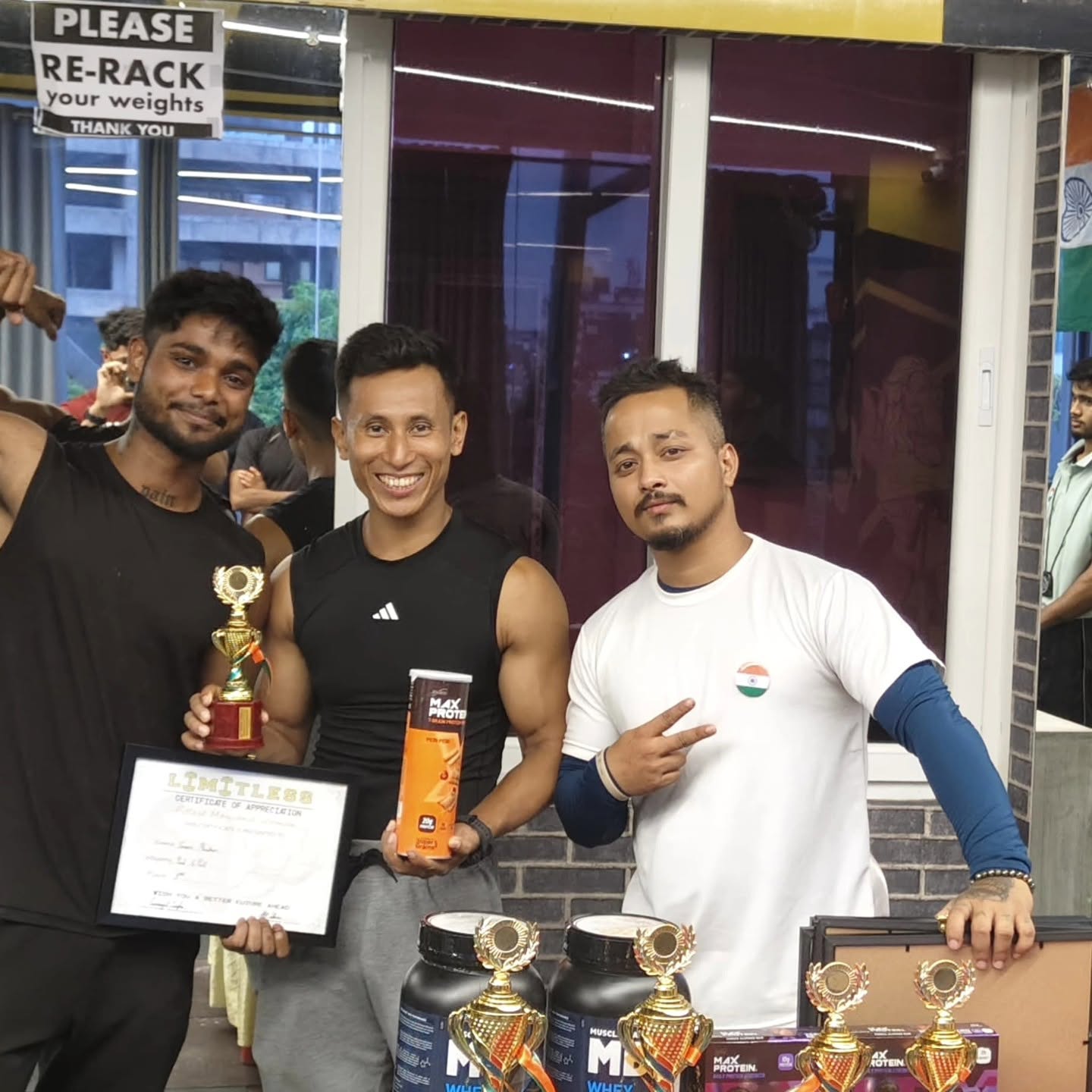 Members with trophies at a Limitless Gym event